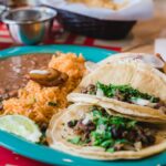 plate of tacos, rice, and beans on a table at a Mexican restaurant | Latin cuisine West Roxbury