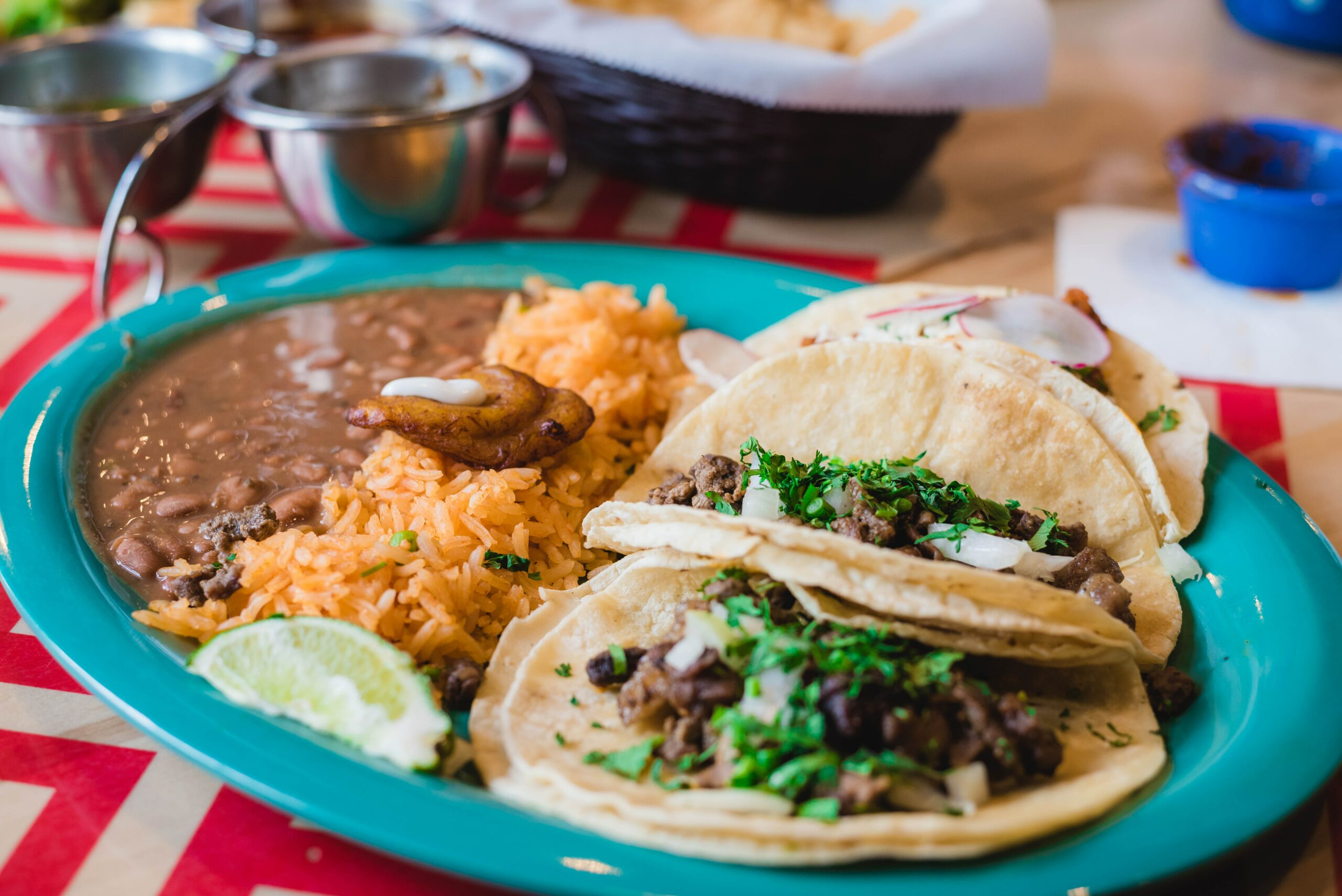 plate of tacos, rice, and beans on a table at a Mexican restaurant | Latin cuisine West Roxbury